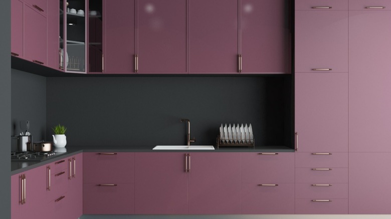 a bright kitchen with purple cabinets