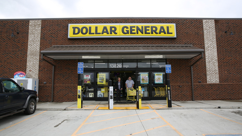 Two people exit a Dollar General store