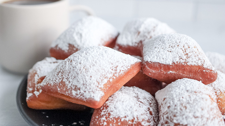 stack of beignets on plate