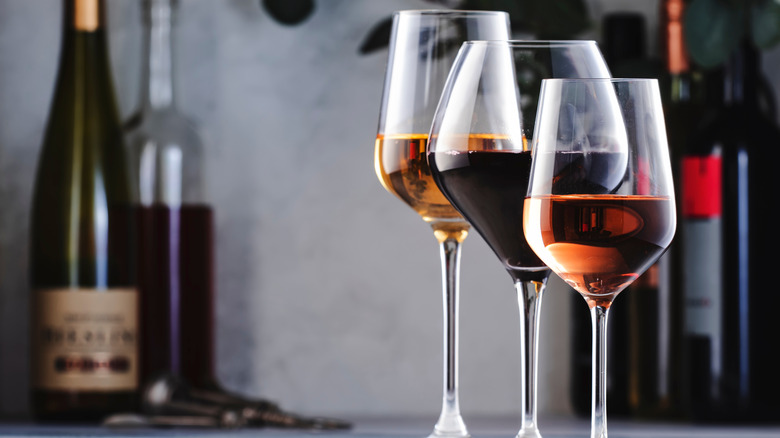 red, white, and rose wine in different styles of glasses