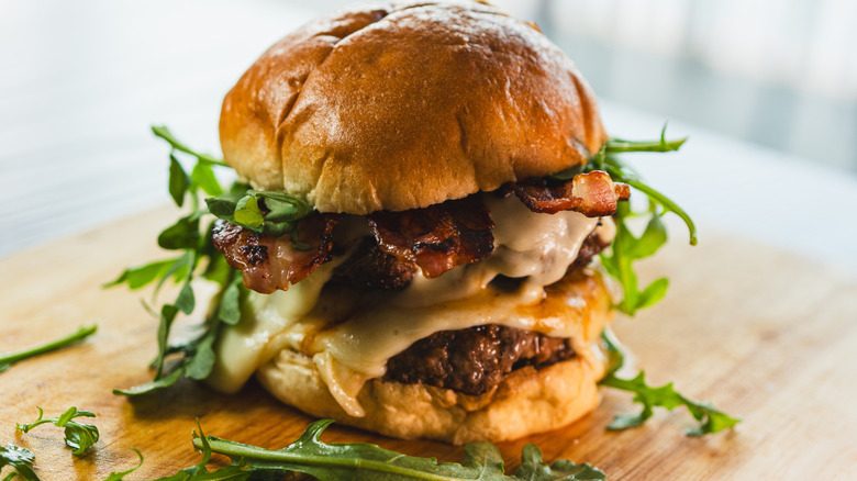 Cheeseburger on wood cutting board