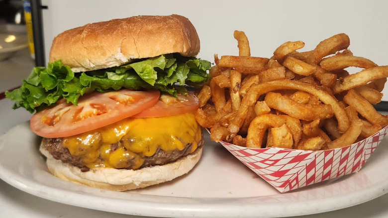 Cheeseburger on wood cutting board