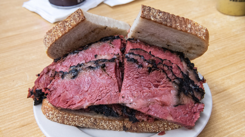 sliced black pastrami sandwich