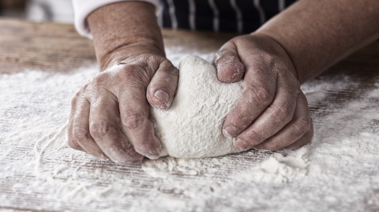 kneading pizza dough