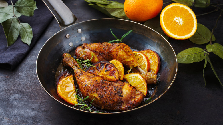 orange with chicken in pan