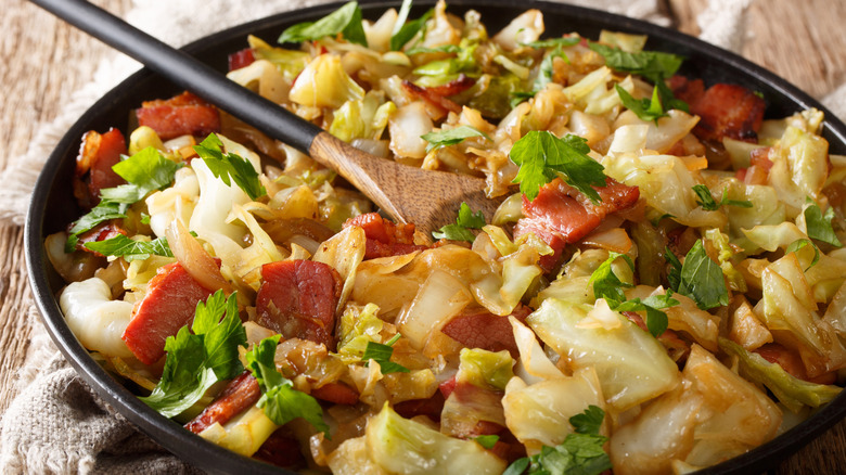 A skillet of fried cabbage and meat