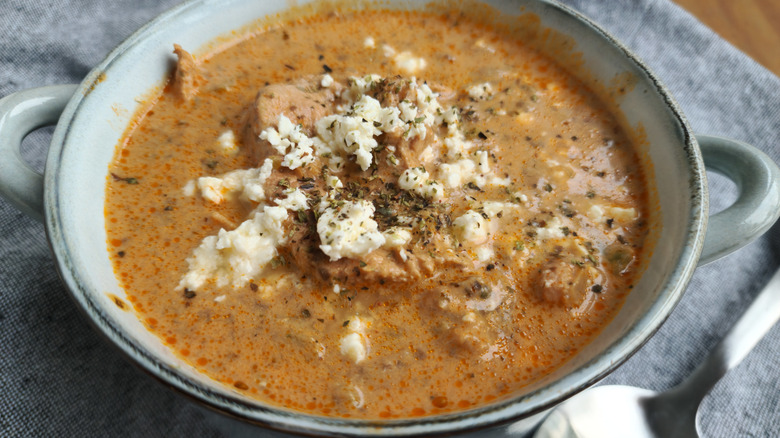 Feta sprinkled on soup with meat