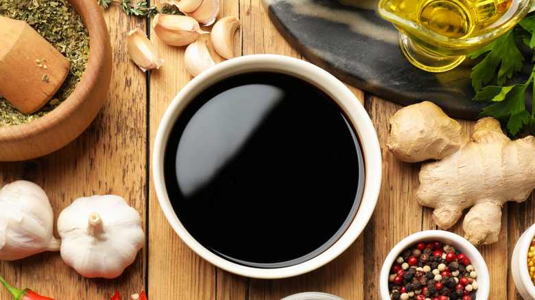 A bowl of soy sauce and aromatics