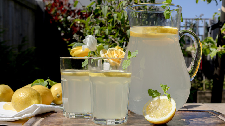 pitcher and glasses of lemonade on a sunny day
