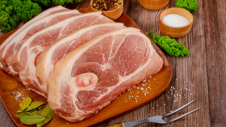 Sliced pork steaks on a cutting board