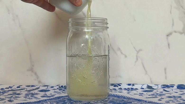 Lime juice poured into glass