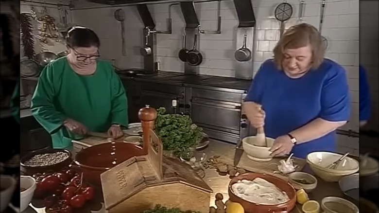 Clarissa Dickson Wright and Jennifer Paterson cooking together in a kitchen