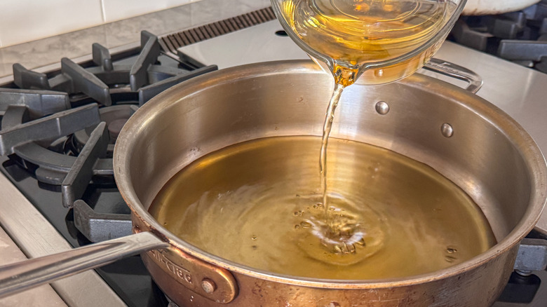 pouring apple cider into pan