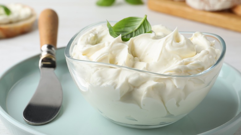Bowl of cream cheese with basil