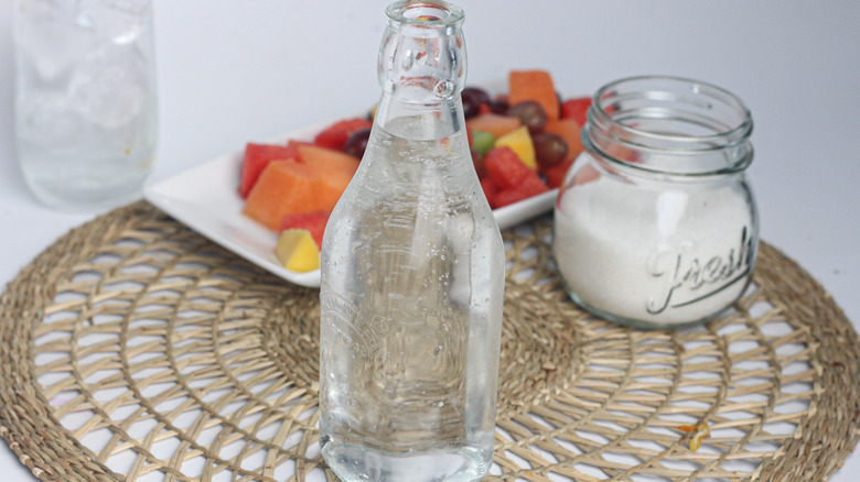 simple syrup bottle and fruit