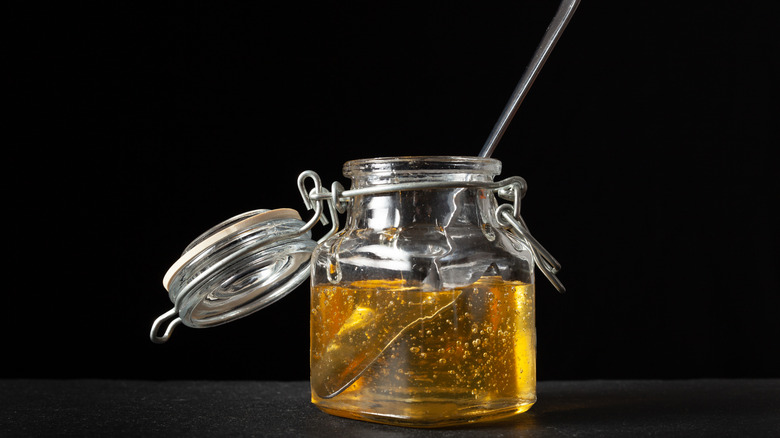 Spoon inside jar of agave nectar