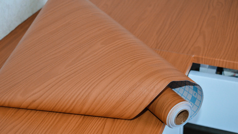 Roll of contact paper in a woody design