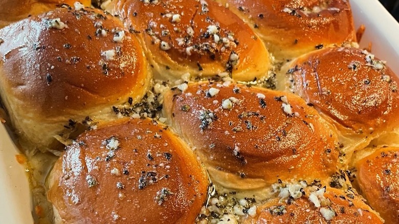 A tray of pizza sliders made of Hawaiian rolls