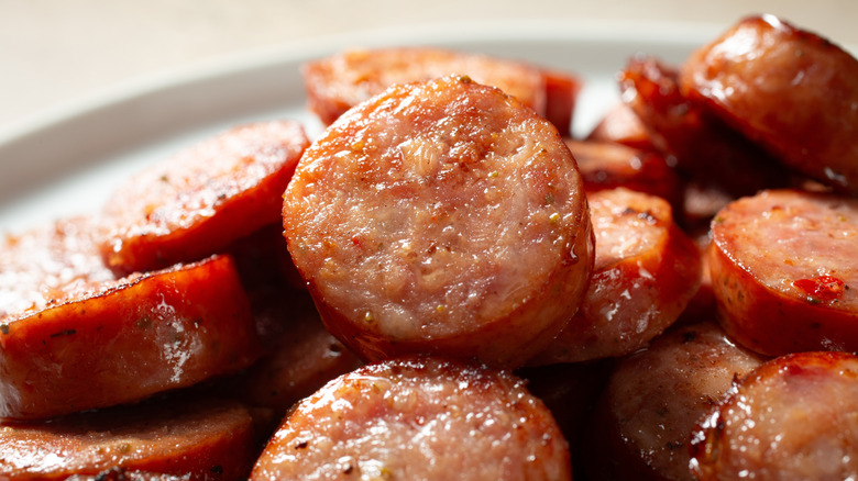 cooked slices of Cajun andouille sausage