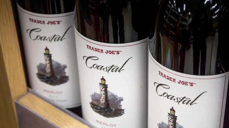 Close-up of bottles of Trader Joe's Coastal Merlot on store shelf