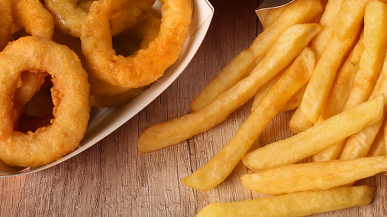 clsoeup of french fries and onion rings