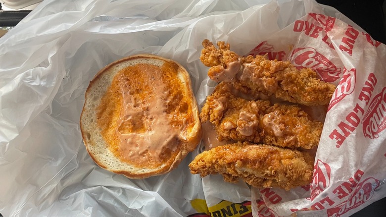 Raising Cane's fried chicken sandwich on bag