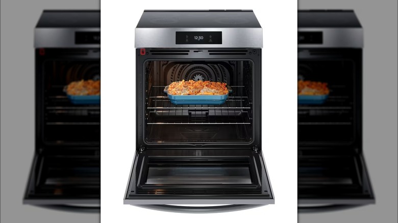 Frigidaire Gallery Induction Range with oven door open to show casserole dish inside