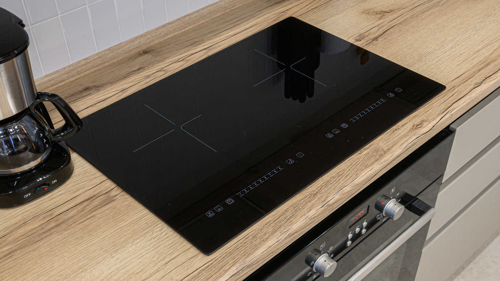 Not LG Or Kenmore — Consumer Reports' Highest-Rated Induction Cooktop Has A Perfect Score