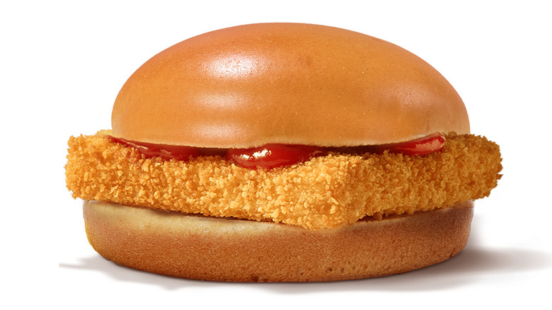 A McFish sandwich, with a piece of fried fish on a bun with ketchup