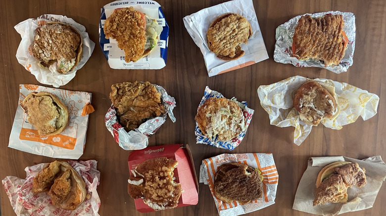 Fast food chicken sandwiches on wood surface
