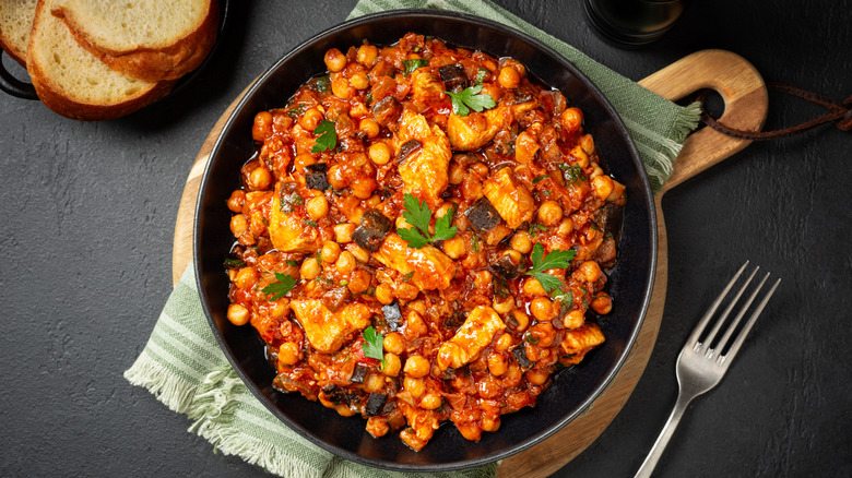 a chickpea and eggplant stew in a cast iron casserole