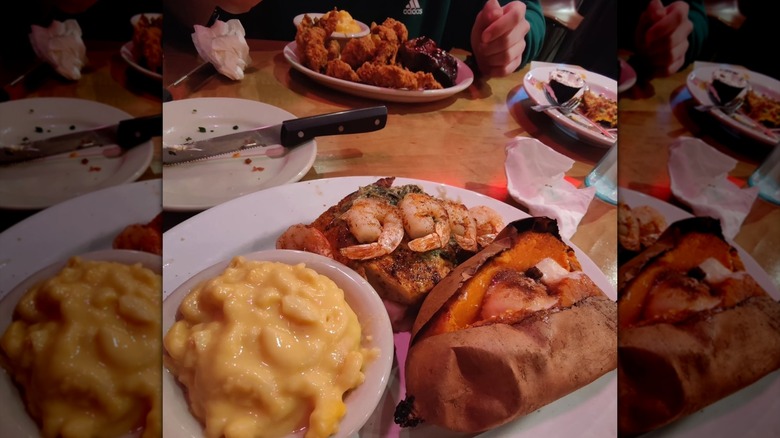 Logan's Roadhouse plates, including steak topped with shrimp