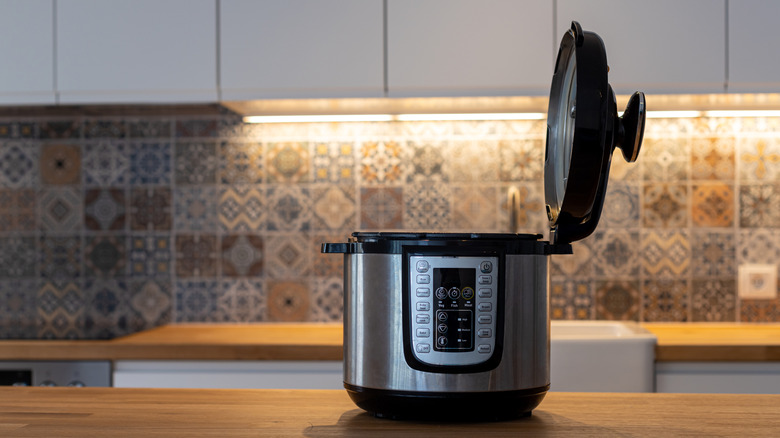 An open Instant Pot on a kitchen countertop