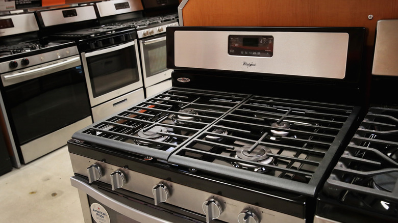 A variety of stoves in a department store.
