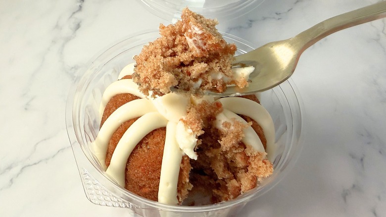 Nothing Bundt Cakes Carrot cake piece on fork above bundtlet