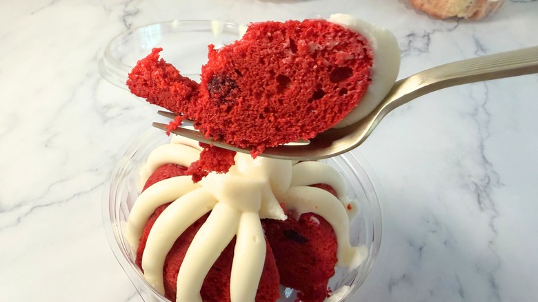 Nothing Bundt Cakes Red Velvet cake piece on fork above bundtlet
