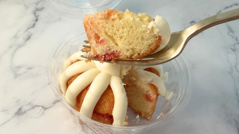 Nothing Bundt Cakes Gluten-Free Lemon Raspberry cake piece on fork above bundtlet