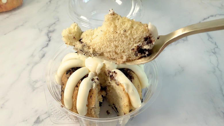 Nothing Bundt Cakes Oreo Cookies &. Cream cake piece on fork above bundtlet