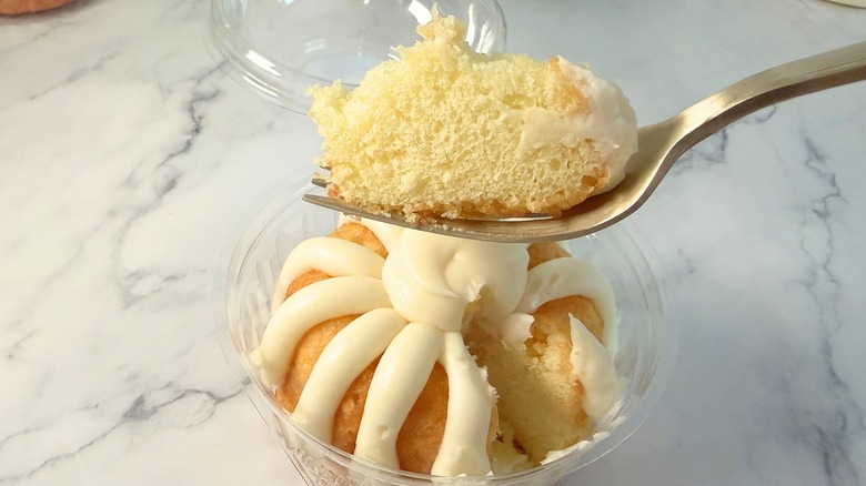 Nothing Bundt Cakes Classic Vanilla cake piece on fork above bundtlet