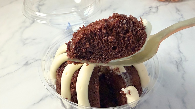 Nothing Bundt Cakes Chocolate Chocolate Chip cake piece on fork above bundtlet