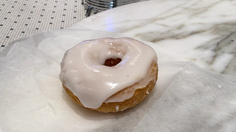 close up of a vanilla frosted gluten-free donut