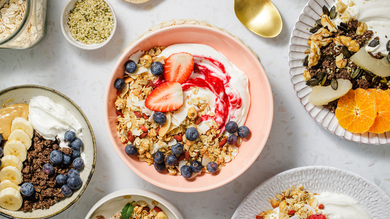 Different preparations of oatmeal with fruit and nuts.