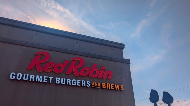 Red Robin sign on the side of the building at twilight
