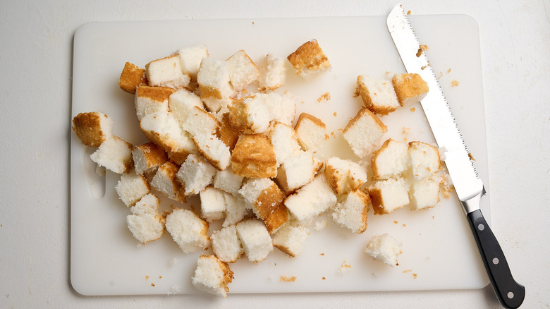 cutting angel food cake into cubes