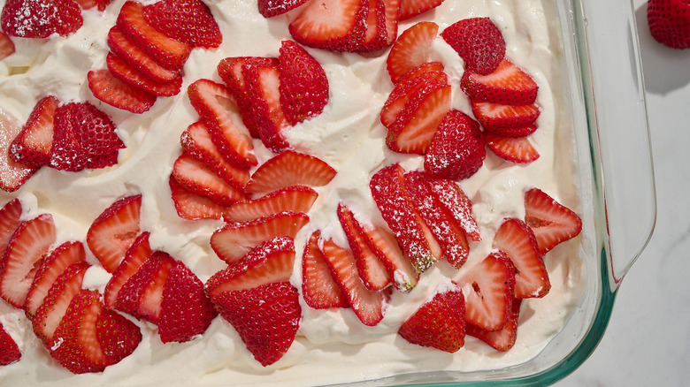 close up of strawberries on top of cake