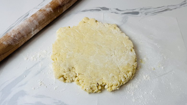 Old-fashioned doughnut dough on floured parchment