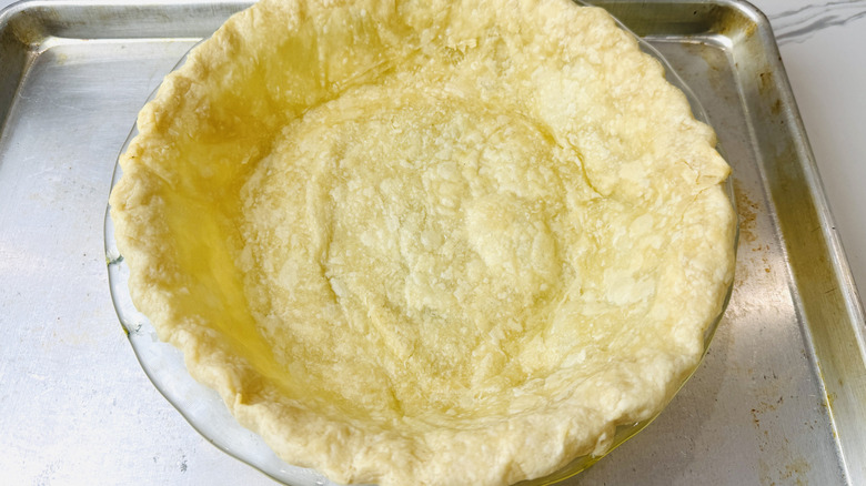 Par-baked pie crust in a pie plate