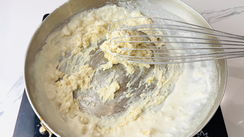 Flour, butter, and milk thickening in saucepan