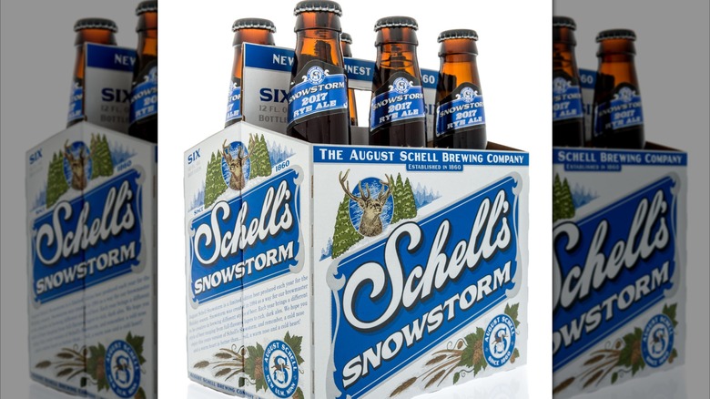 Mirrored image of a six pack of Schell's beer bottles