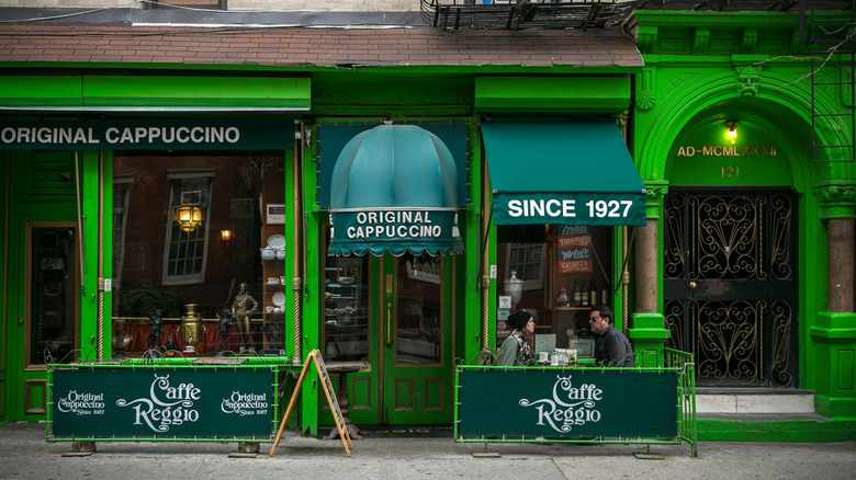 Cafe Reggio exterior with two customers dining outdoors